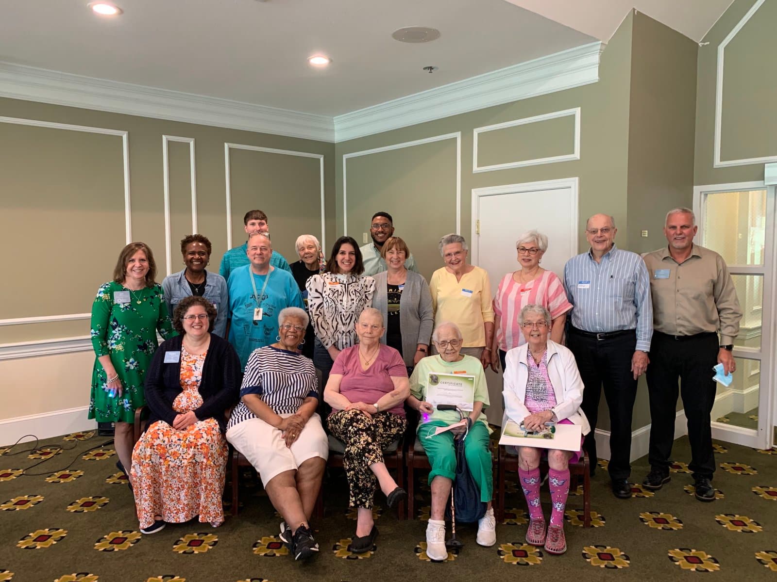 Sura with residents and leaders of United Church Homes