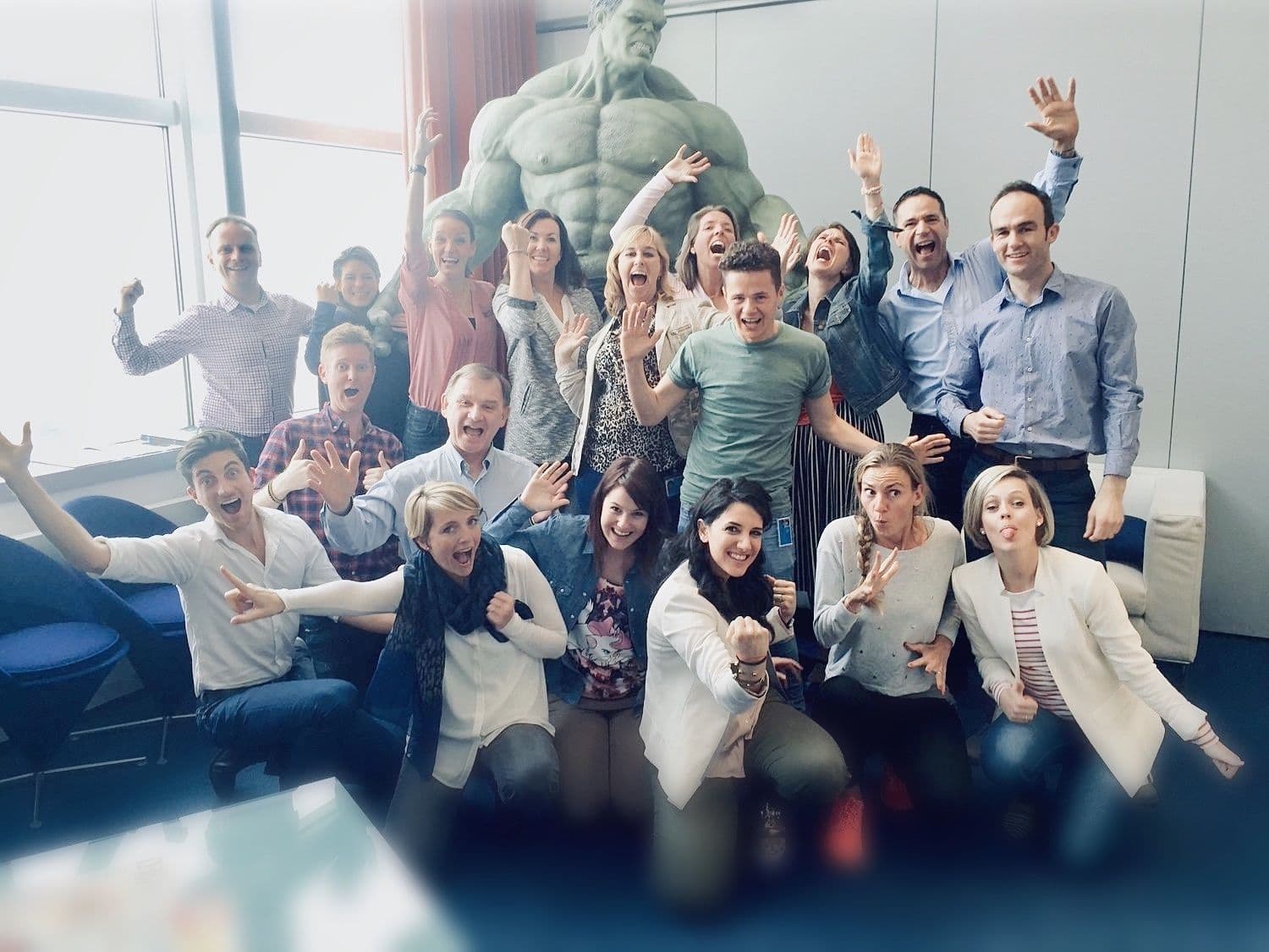 A team cheering together after an Unleash Your Creativity session